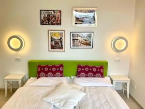 A bed or beds in a room at casa prima gardenia