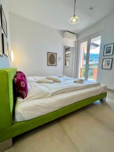A bed or beds in a room at casa prima gardenia