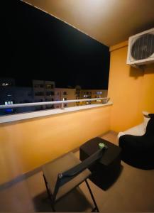 a room with a desk and a chair and a window at Apartman Dobrinja 1 in Sarajevo
