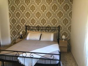 Een bed of bedden in een kamer bij "In viaggio come a casa" vicino alla Stazione, LTScalo!