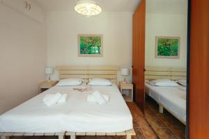 Postel nebo postele na pokoji v ubytování Βίλλα Φανούλα Villa Fanoula
