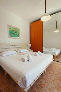 Postel nebo postele na pokoji v ubytování Βίλλα Φανούλα Villa Fanoula