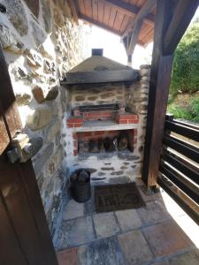an outdoor brick oven in a stone building at Mes Maisons - Two Gites with Private and Shared pools in Cévennes in Gagnières