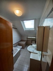 a bathroom with two sinks and a skylight at Appartamento Felicia in San Benedetto del Tronto +50 photos