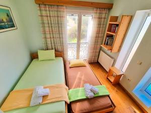 Postel nebo postele na pokoji v ubytování Artemis House