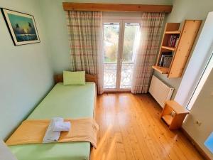 Postel nebo postele na pokoji v ubytování Artemis House