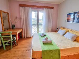 Postel nebo postele na pokoji v ubytování Artemis House
