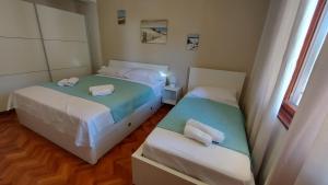 Posteľ alebo postele v izbe v ubytovaní Kuća Magnolija