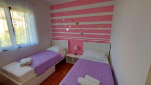Posteľ alebo postele v izbe v ubytovaní Kuća Magnolija