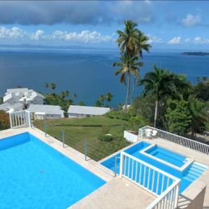 a swimming pool with a view of the ocean at Perfect Paradise, Oceanview in Samana in Santa Bárbara de Samaná +57 photos
