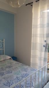 Postel nebo postele na pokoji v ubytování Casa Azzurra