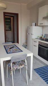 Kuchyň nebo kuchyňský kout v ubytování Casa Azzurra