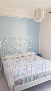 Postel nebo postele na pokoji v ubytování Casa Azzurra