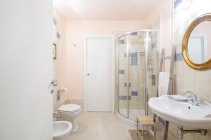 a bathroom with a sink and a toilet and a shower at Residenza dei Piaceri Perduti-Rosa in Lastra a Signa +68 photos