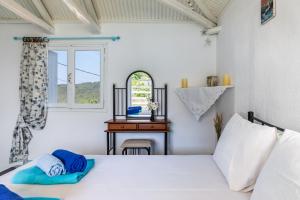 Postel nebo postele na pokoji v ubytování Pastalia Cottage