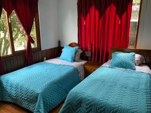 Letto o letti in una camera di MY HOUSE IN MACAS