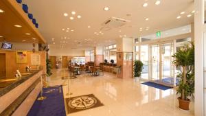 a lobby of a building with plants in it at Toyoko Inn Yonago Ekimae in Yonago +34 photos