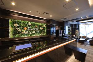 Una televisión o centro de entretenimiento en Hotel Actel Nagoya Nishiki