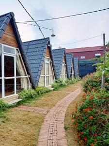 a row of houses with blue roofs at Homestay Bình Huy in Mộc Châu