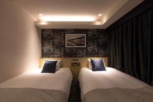 Una cama o camas en una habitación de Hotel Actel Nagoya Nishiki