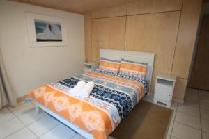 a bedroom with a large bed with two pillows at The Jetty at Cowan Cowan in Cowan Cowan