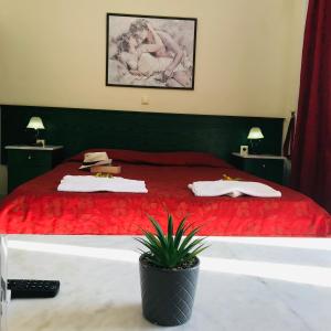 מיטה או מיטות בחדר ב-L'eremo Luxury Studio