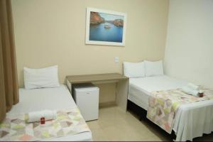 Katil atau katil-katil dalam bilik di Canions Pousada