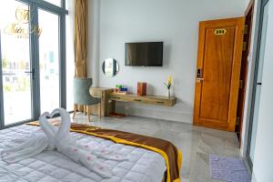 Postel nebo postele na pokoji v ubytování Khách Sạn Thiên Mỹ