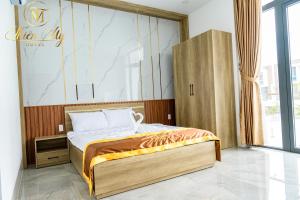 Postel nebo postele na pokoji v ubytování Khách Sạn Thiên Mỹ
