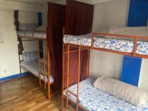Letto o letti in una camera di Planet Nomad Hostel