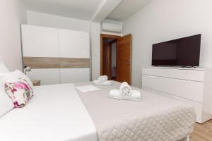 Ένα ή περισσότερα κρεβάτια σε δωμάτιο στο Waterfront Apartment Petrovina
