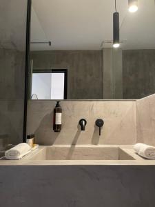 a bathroom with a large bath tub with a mirror at La Cupric in Sarichioi