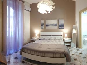 Ένα ή περισσότερα κρεβάτια σε δωμάτιο στο HomeholidayinSicily - Room ovest