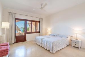 A bed or beds in a room at Villa Lumb