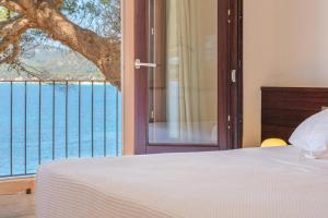 A bed or beds in a room at Villa Lumb