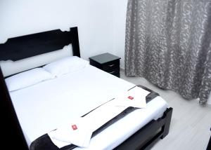 Cama o camas de una habitación en AROMA CAFÉ IV