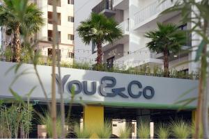 a sign for a yerba co building at YouCo coliving Dubai in Dubai