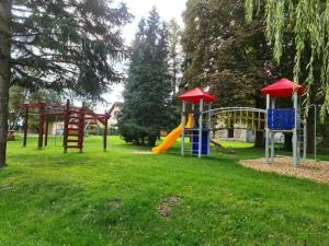 a park with a playground with a slide at Ferienwohnung im Herzen von Thüringen in Blankenhain