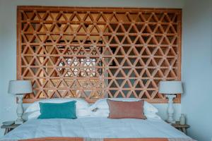 Posteľ alebo postele v izbe v ubytovaní Borgo 69 Villas & Suites