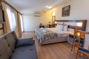 Кровать или кровати в номере Hotel Karacam