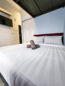 Katil atau katil-katil dalam bilik di Mac Hotel by Sky Hive