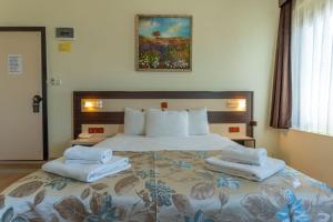 Кровать или кровати в номере Hotel Karacam