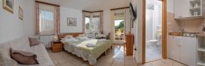 Postel nebo postele na pokoji v ubytování Apartmani Putnik + 37 fotografií
