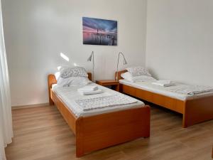 Posteľ alebo postele v izbe v ubytovaní Apartman Zablace