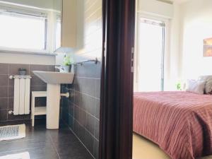 A bed or beds in a room at Stepandgo Milano Navigli