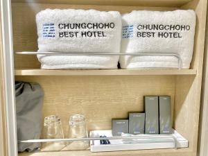 a closet with towels and other items in it at Chungchoho Best Hotel in Sokcho