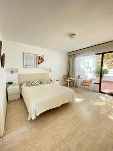 Ένα ή περισσότερα κρεβάτια σε δωμάτιο στο Apartamentos Haus Am Meer