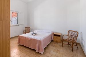 Posteľ alebo postele v izbe v ubytovaní Villa Edy