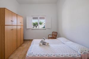 Posteľ alebo postele v izbe v ubytovaní Villa Edy
