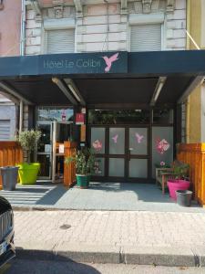 a building with a sign that reads hospital league coalition at Hotel Le Colibri in Aix-les-Bains